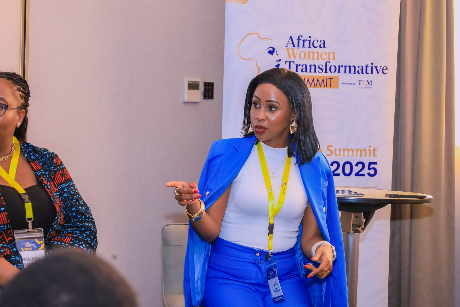 Joy Mido moderating a panel at the Africa Women Transformative Summit