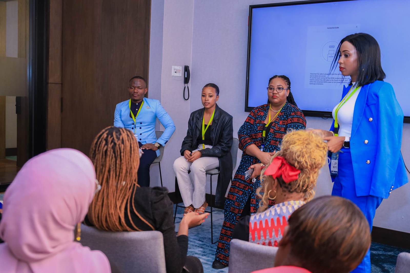 Joy Mido speaking to the summit audience
