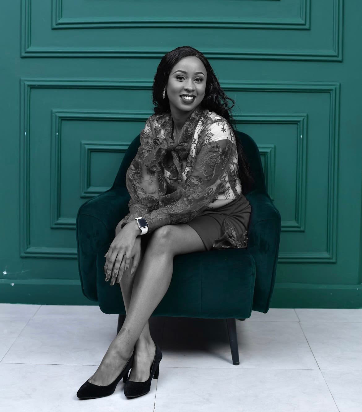 Joy Mido in conversation wearing a beaded collar