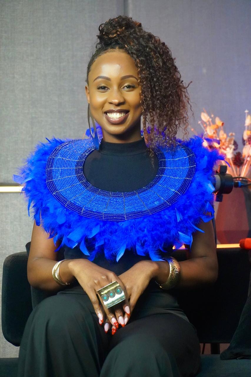 Joy Mido wearing an African-inspired blue beaded collar